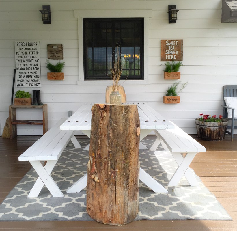 Rustic porch with DIY picnic table and wood log chairs