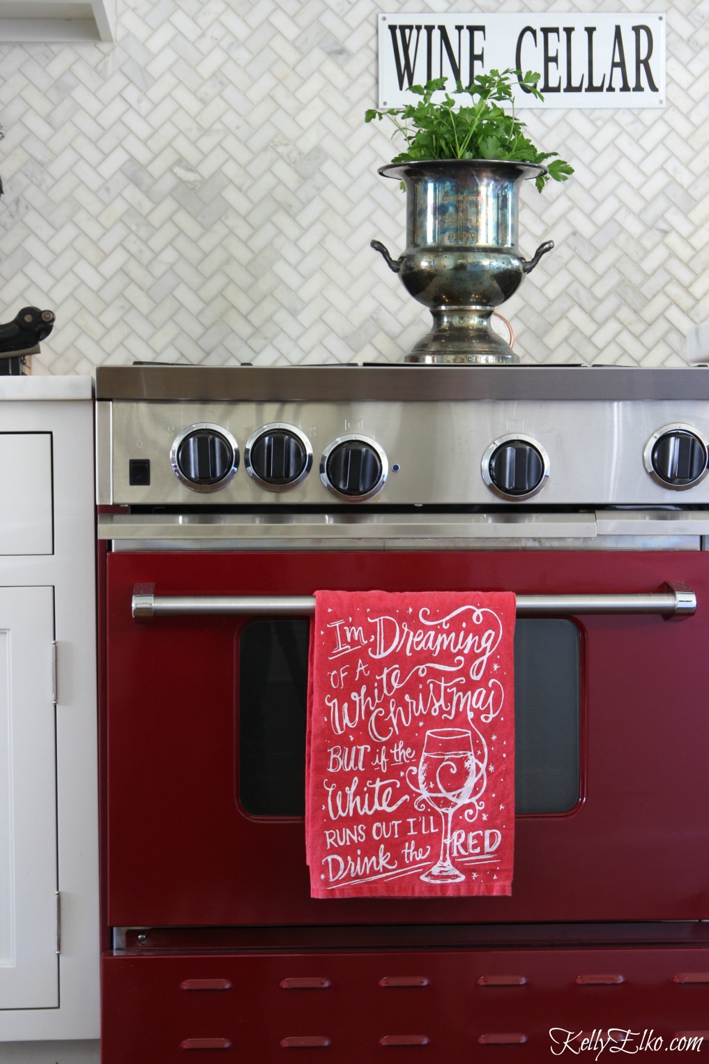 Love this red stove and white herringbone marble backsplash kellyelko.com