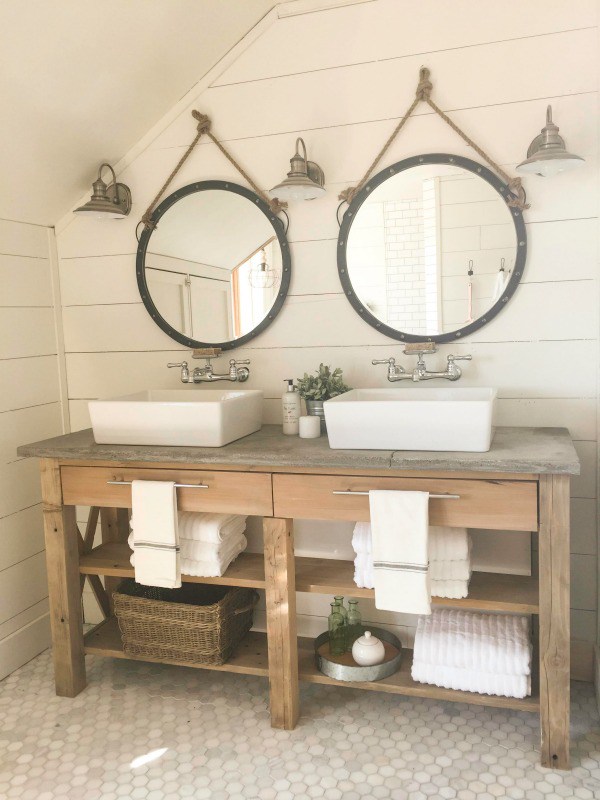 Rustic wood bathroom vanity with modern sinks and shiplap walls