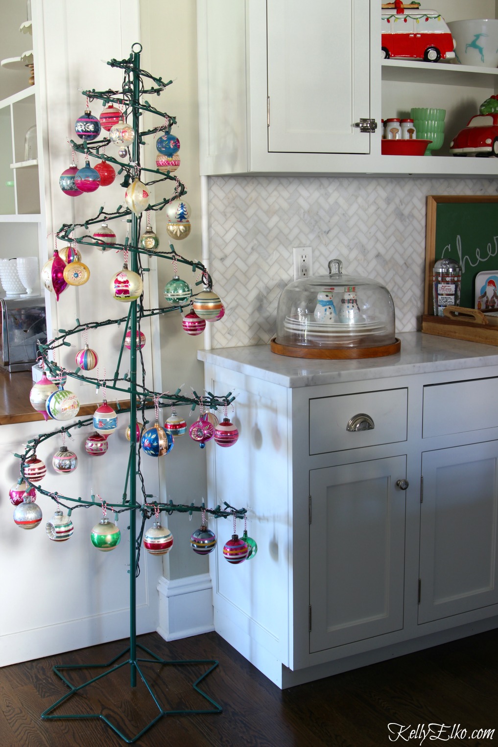 Love this wire Christmas tree filled with vintage Shiny Brite ornaments kellyelko.com