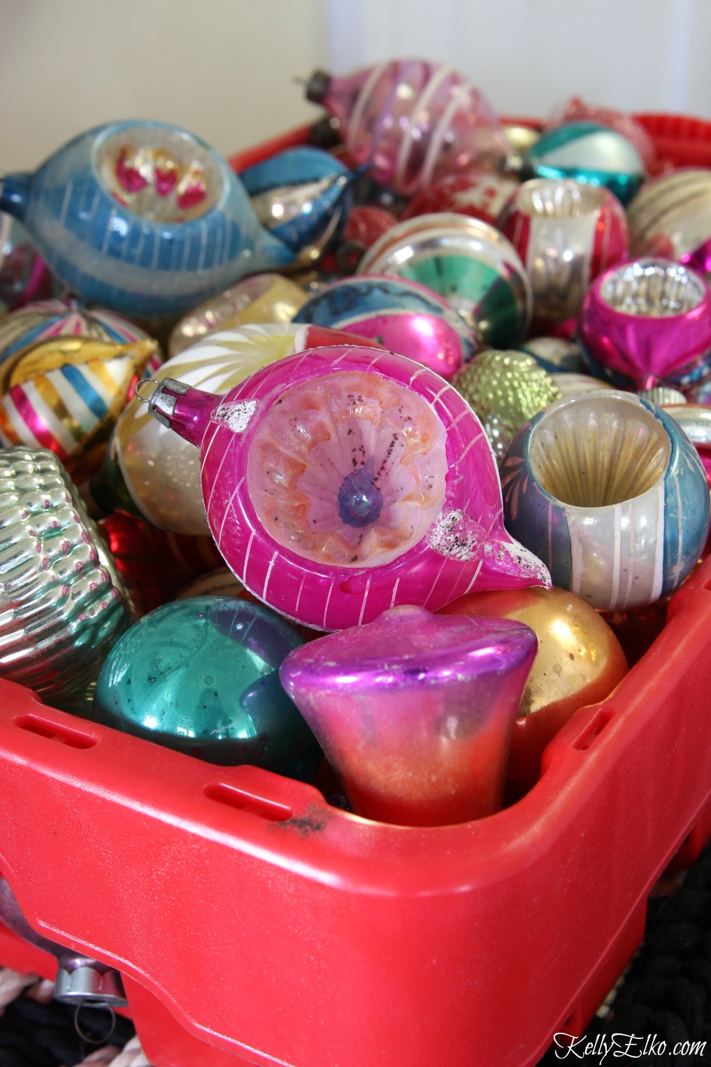 Vintage shiny brite ornaments in an old soda crate kellyelko.com