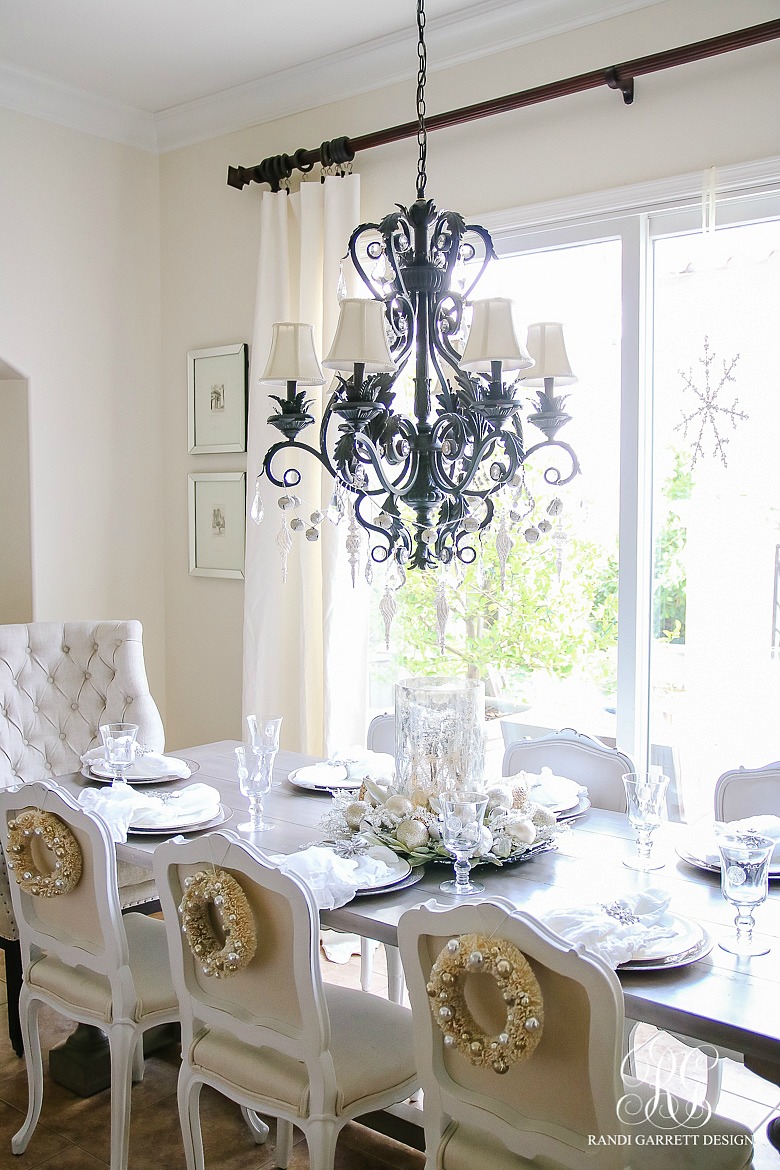 Add Christmas wreaths to the back of dining chairs for a festive touch 