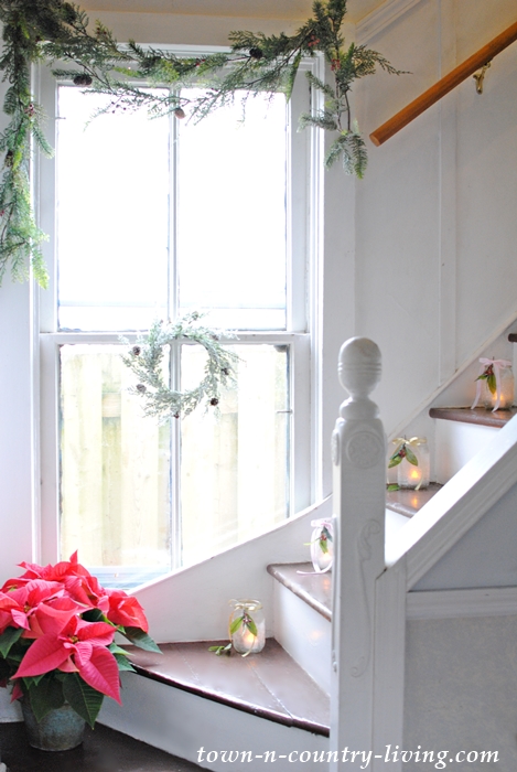 Christmas staircase with candles in jars