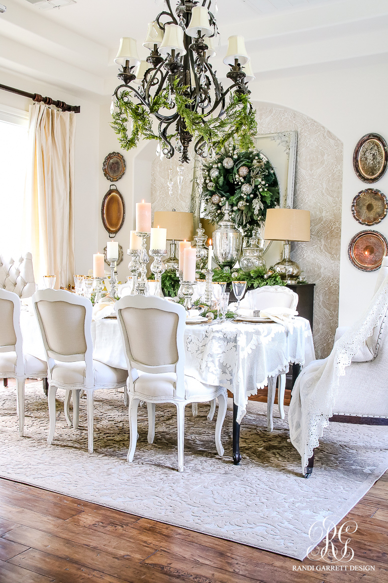 Christmas dining room - love the garland on the chandelier