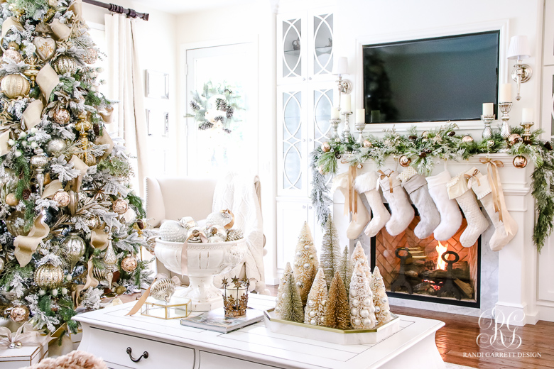 Love this Christmas home in golds and whites and the row of stockings 