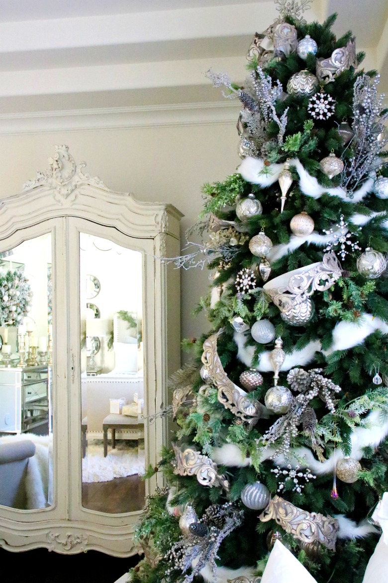 Beautiful bedroom Christmas tree - love the mirrored armoire