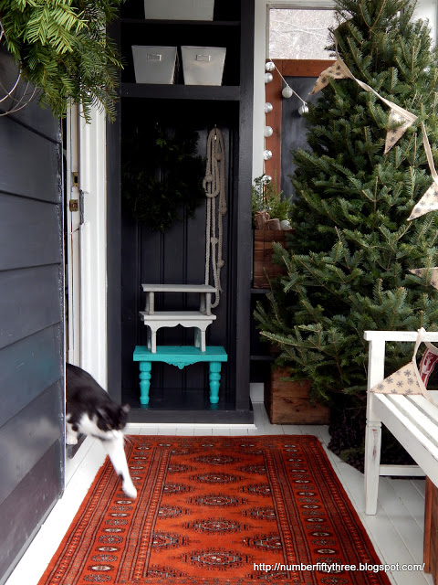 Christmas mudroom - love the almost bare tree