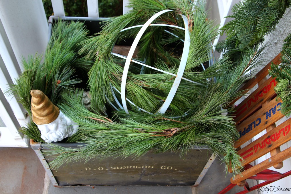 Christmas Porch - fill a planter with fresh garland kellyelko.com