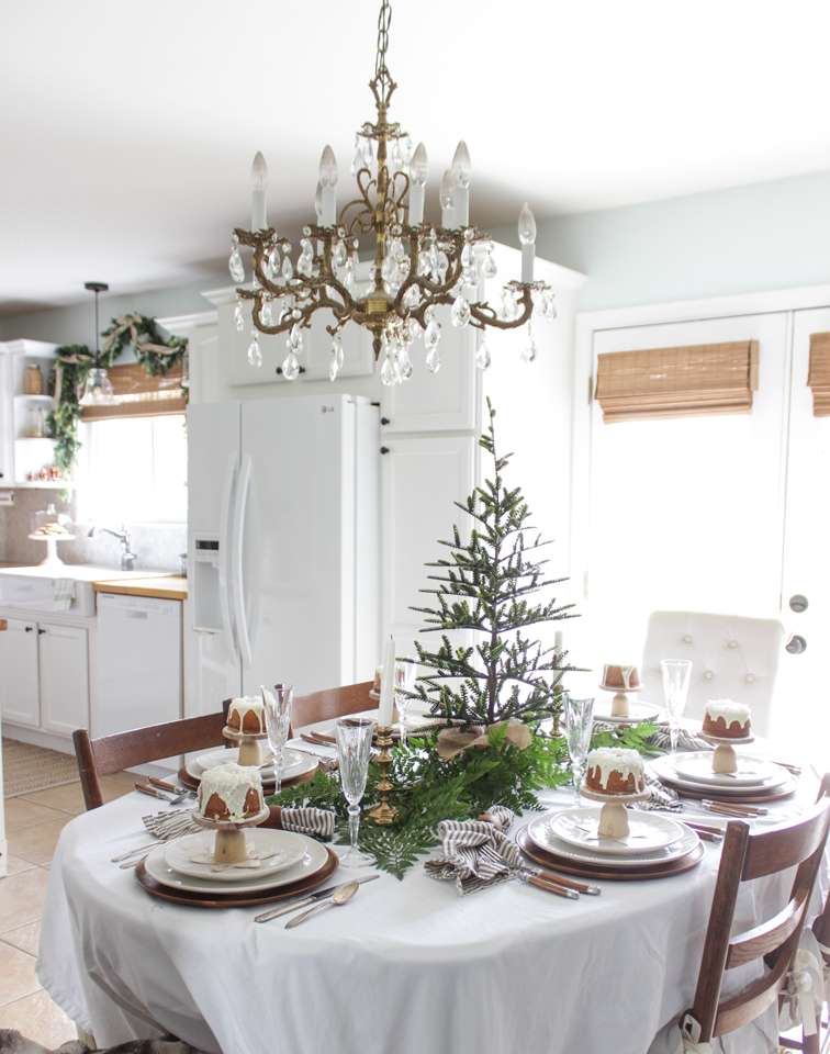 Fun Christmas table - love the mini tree centerpiece and individual cakes at each place setting