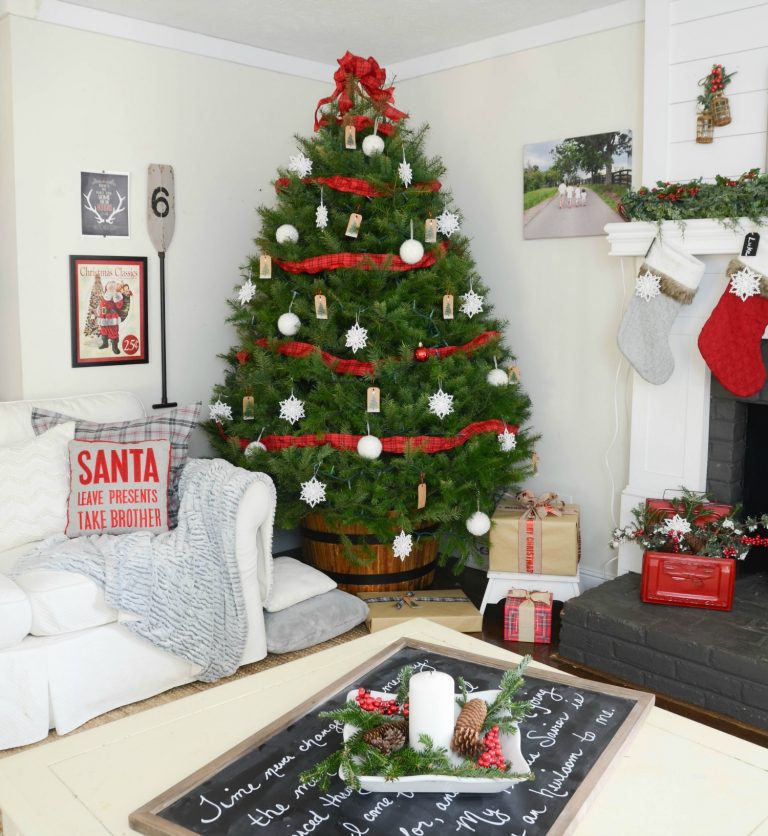 Christmas tree in a whiskey barrel and love the chalkboard tray on the ottoman