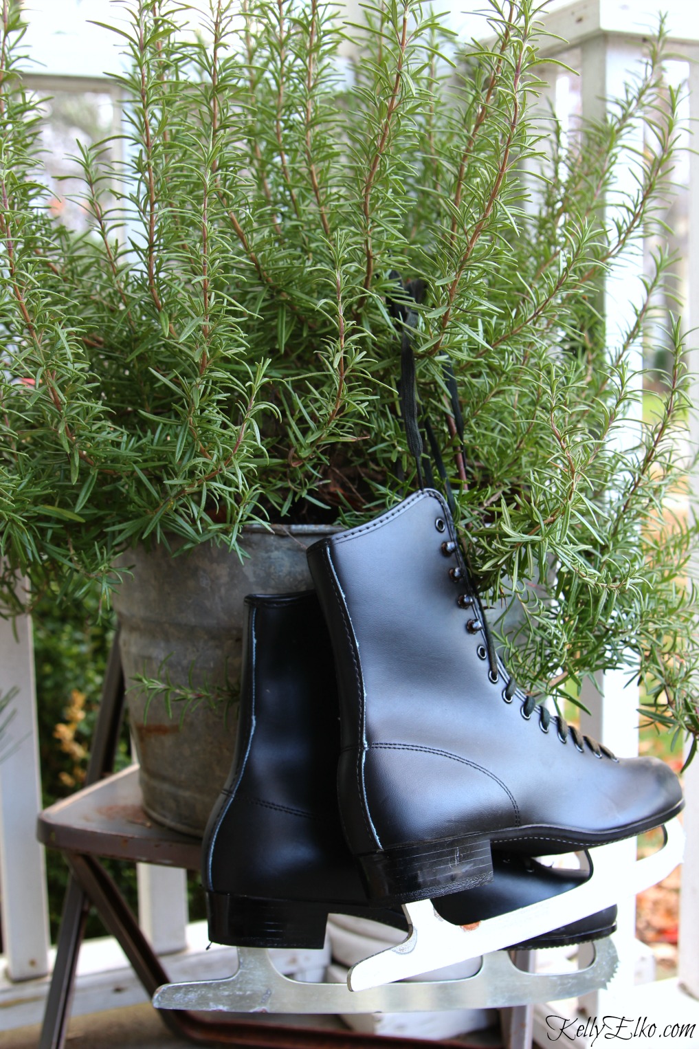 Tie an old pair of ice skates to a planter on this Christmas porch kellyelko.com