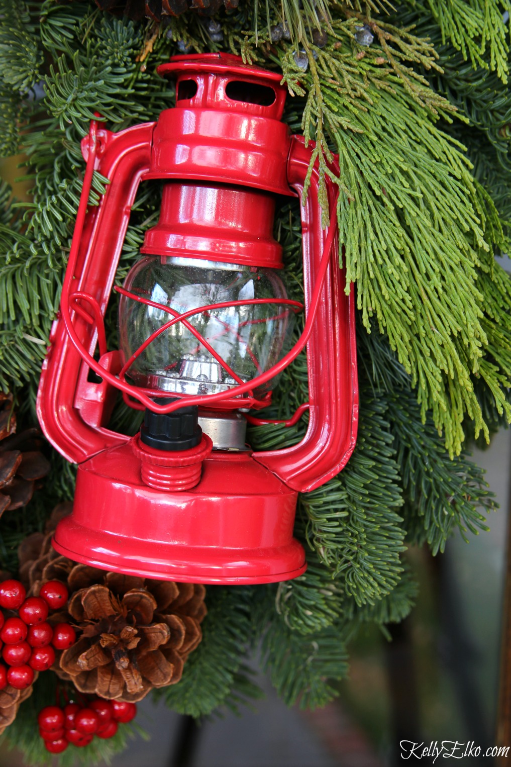 Cute little red lantern on a Christmas wreath kellyelko.com