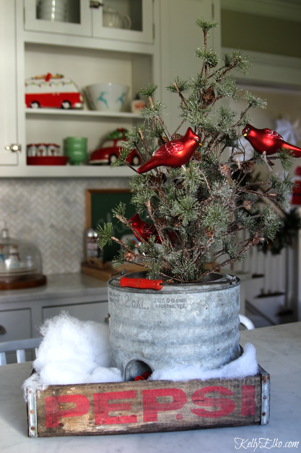 Vintage Pepsi crate makes a fun tray for Christmas and I love the old galvanized cooler with mini tree kellyelko.com