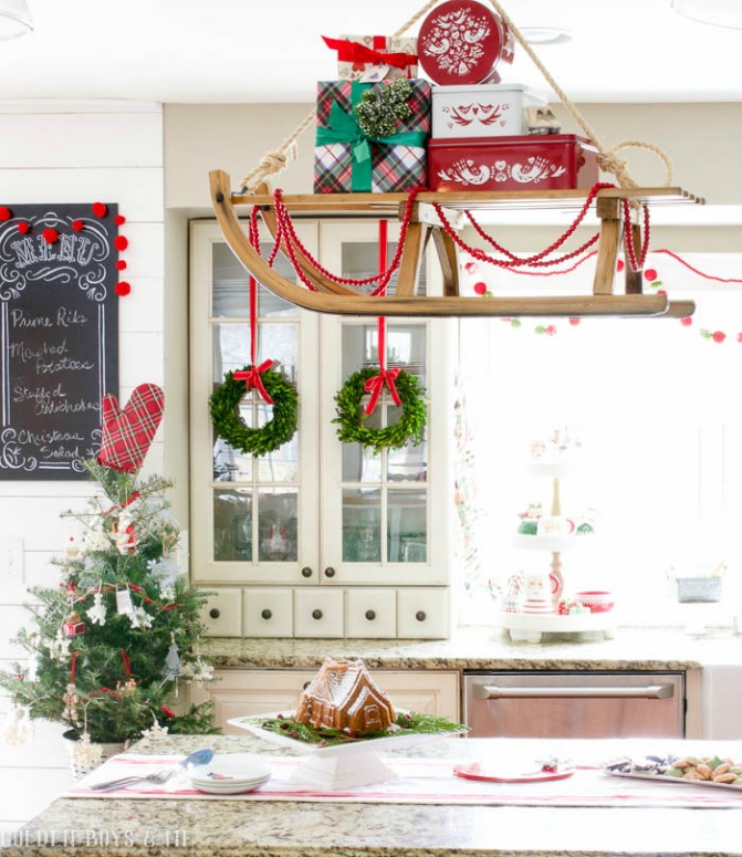 Hang a vintage sled over the kitchen island for a fun Christmas display