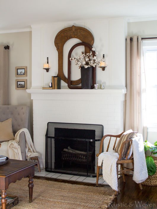 Empty wood frames make a stunning mantel display in this farmhouse living room kellyelko.com