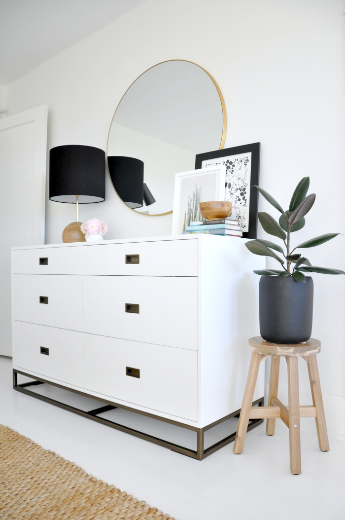 Bedroom dresser with round mirror