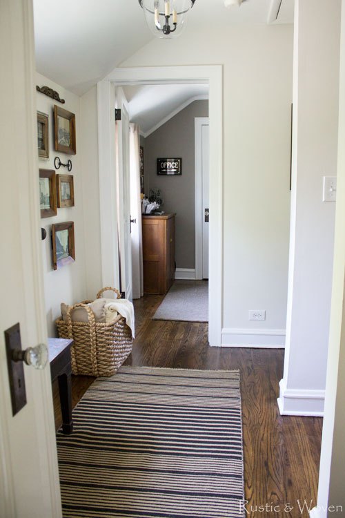 Neutral farmhouse hallway with gallery wall