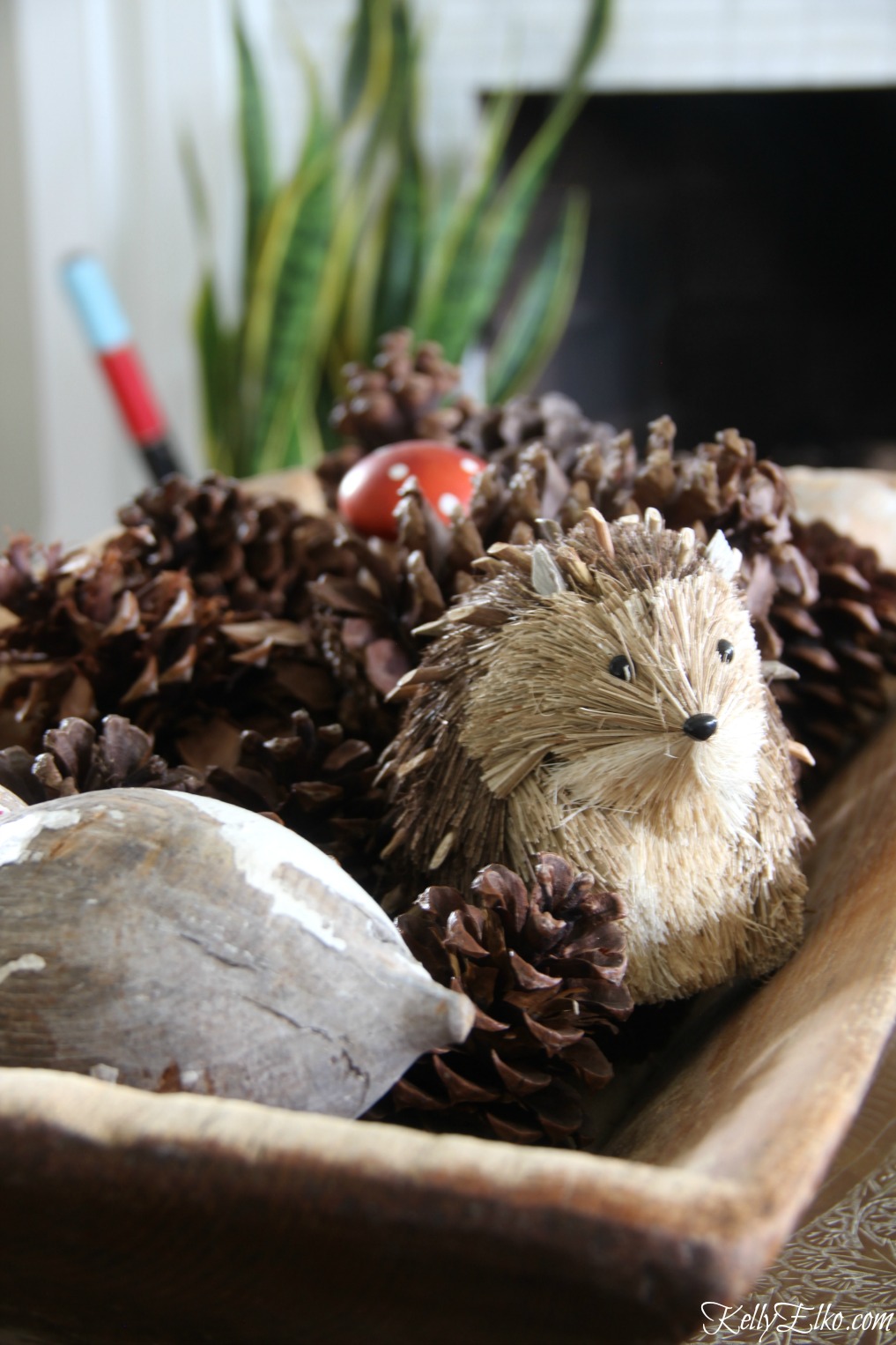 Dough bowl pine cone display - a little critter is a fun touch kellyelko.com