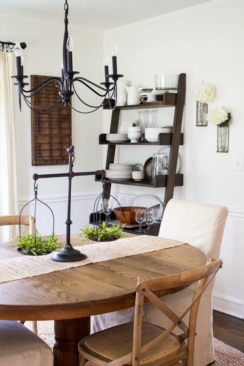 Neutral farmhouse dining room with open shelf storage 