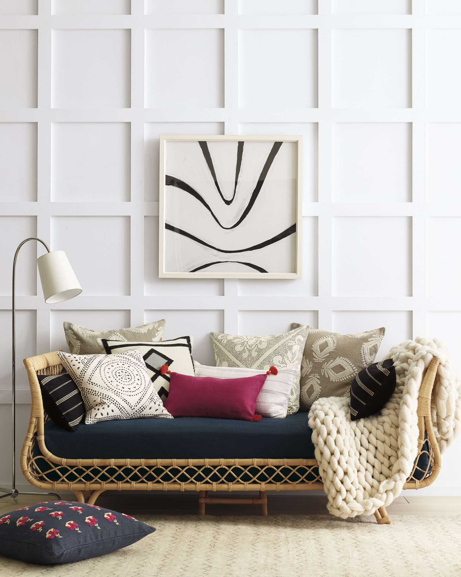 Love this rattan daybed with a mix of colorful pillows 