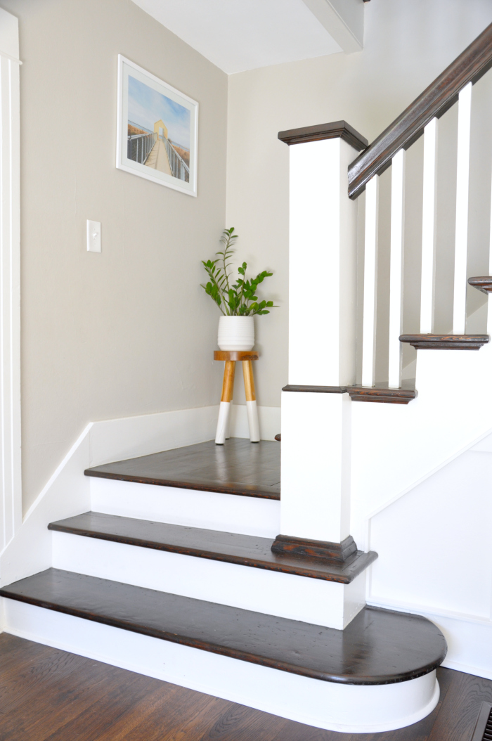 Dark wood stair risers with white railings kellyelko.com