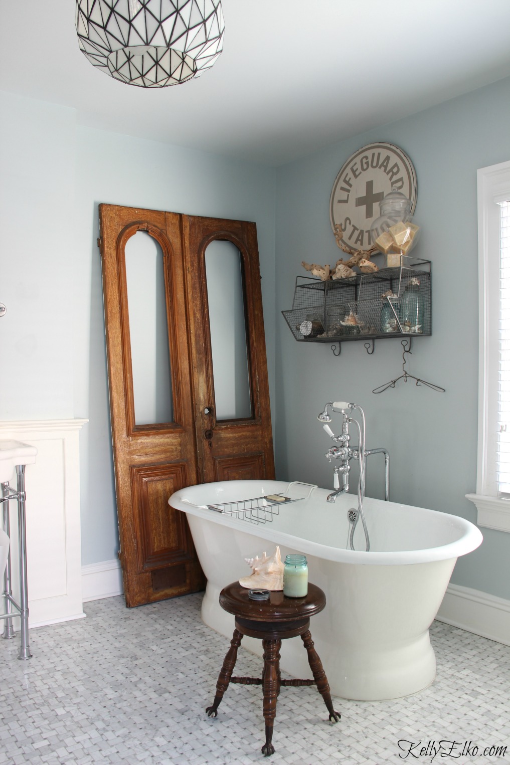 Antique arched doors add warmth to a bathroom kellyelko.com