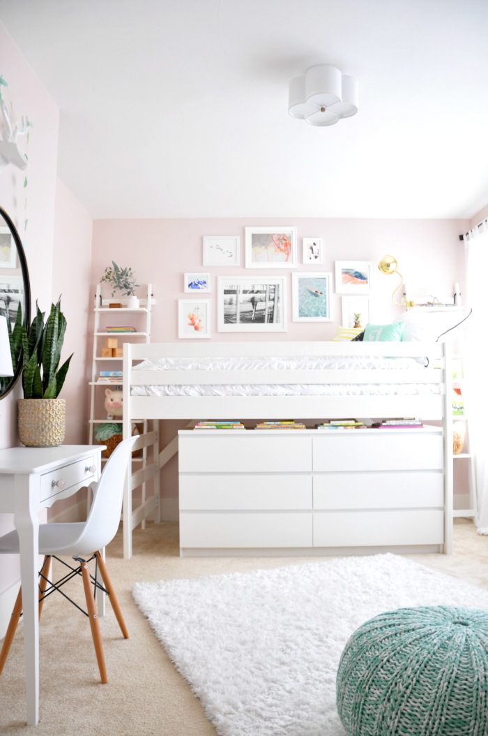 Cute pink girls bedroom with bunk bed and gallery wall