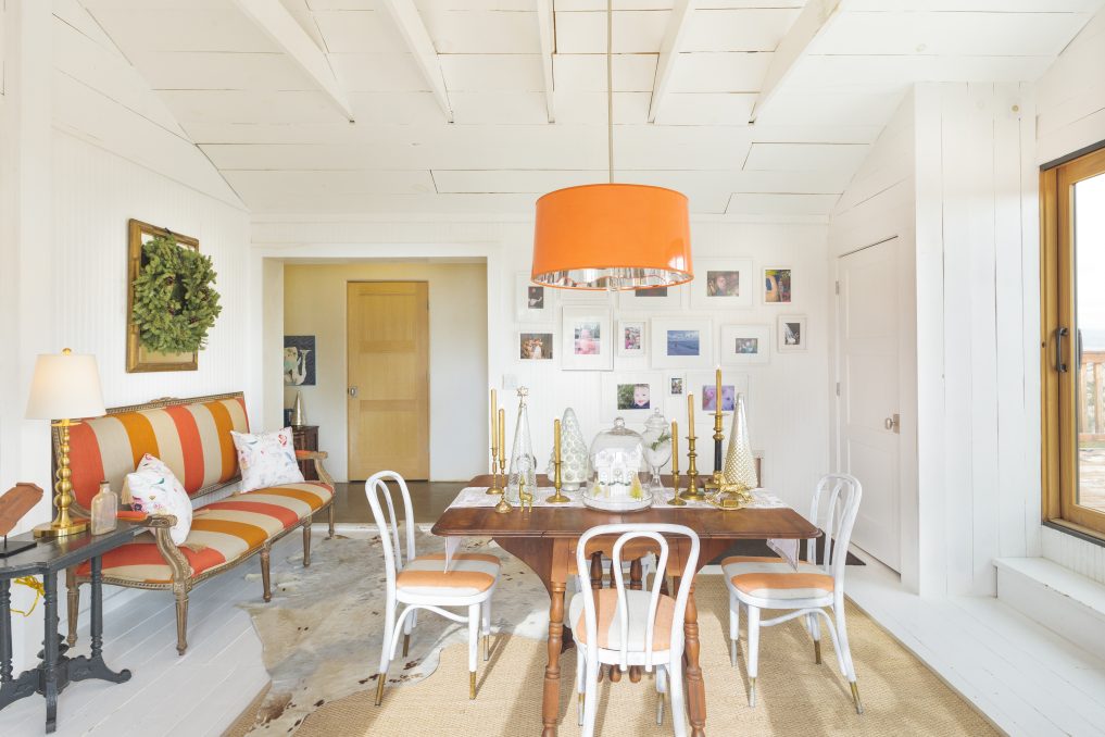 Love this fun, colorful dining room and huge orange chandelier