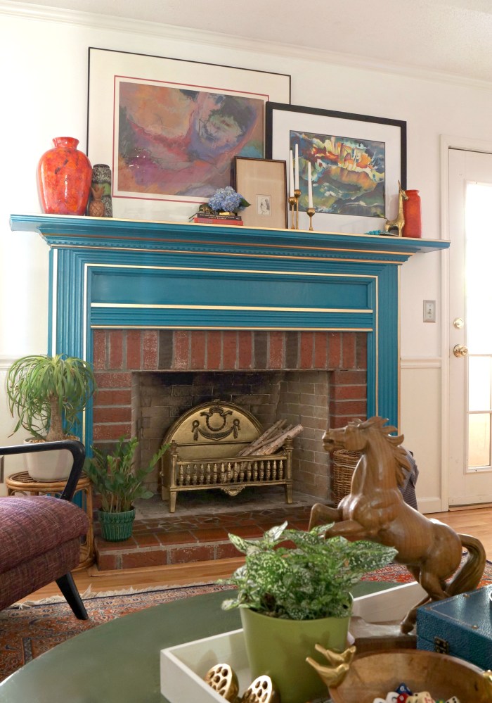 Add a pop of color to a mantel - love the bold blue with gold accents