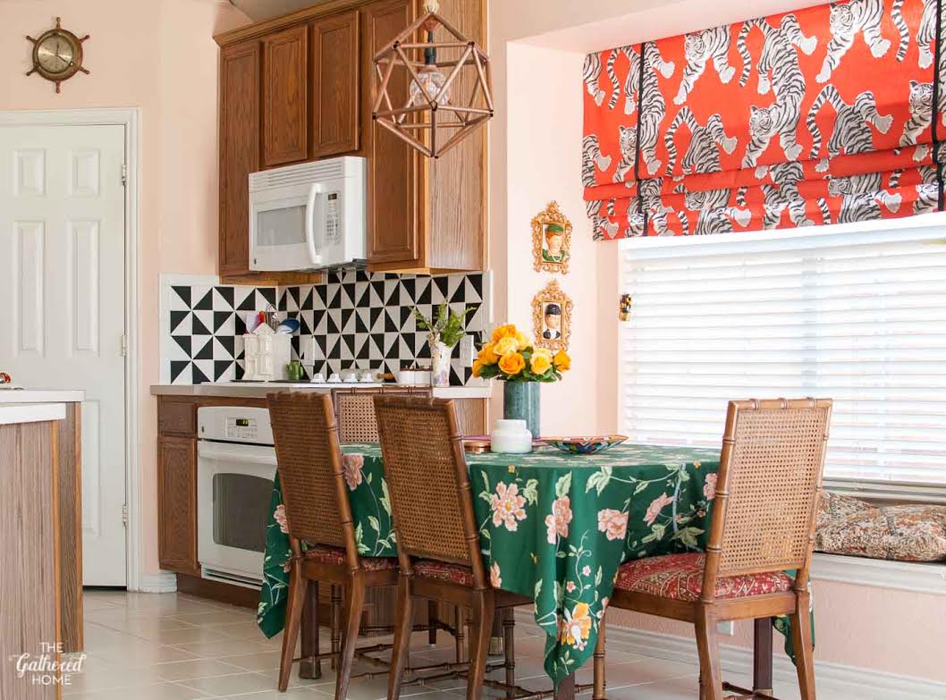 Colorful kitchen - love the tiger fabric roman shade 