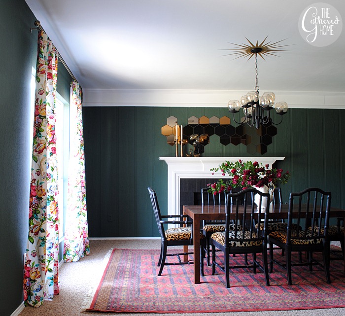 Love this moody green dining room with vintage red rug and floral curtains