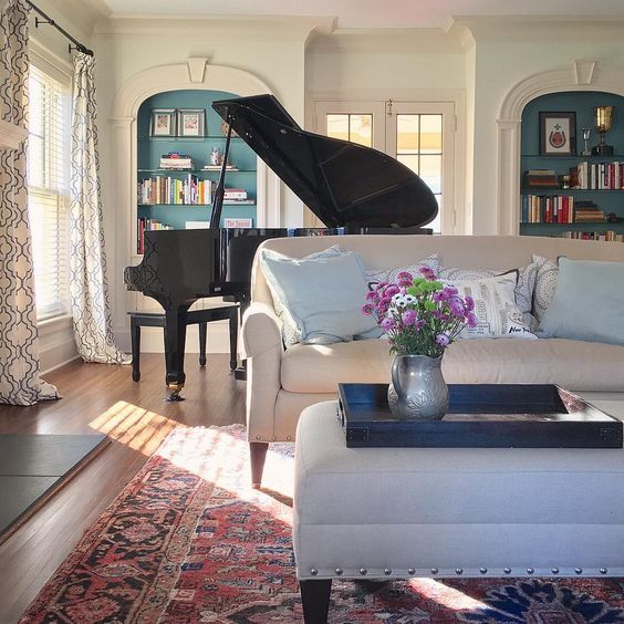 Grand piano in a grand room - love the arched built in bookcases with blue paint kellyelko.com