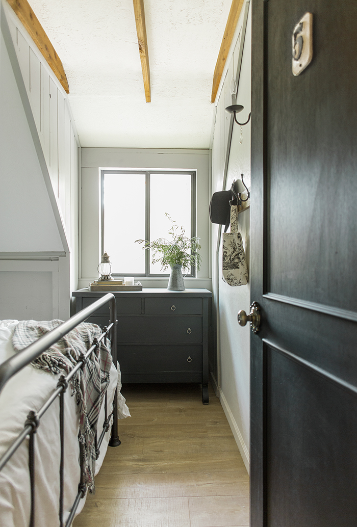 Black interior doors add drama to a neutral home