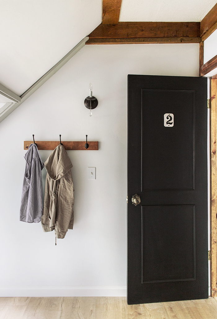 Black interior doors and each bedroom has it's own number