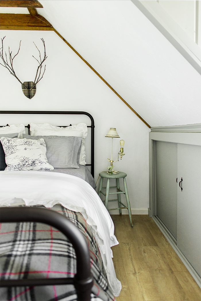 Love the vintage style bed with a little stool as a nightstand