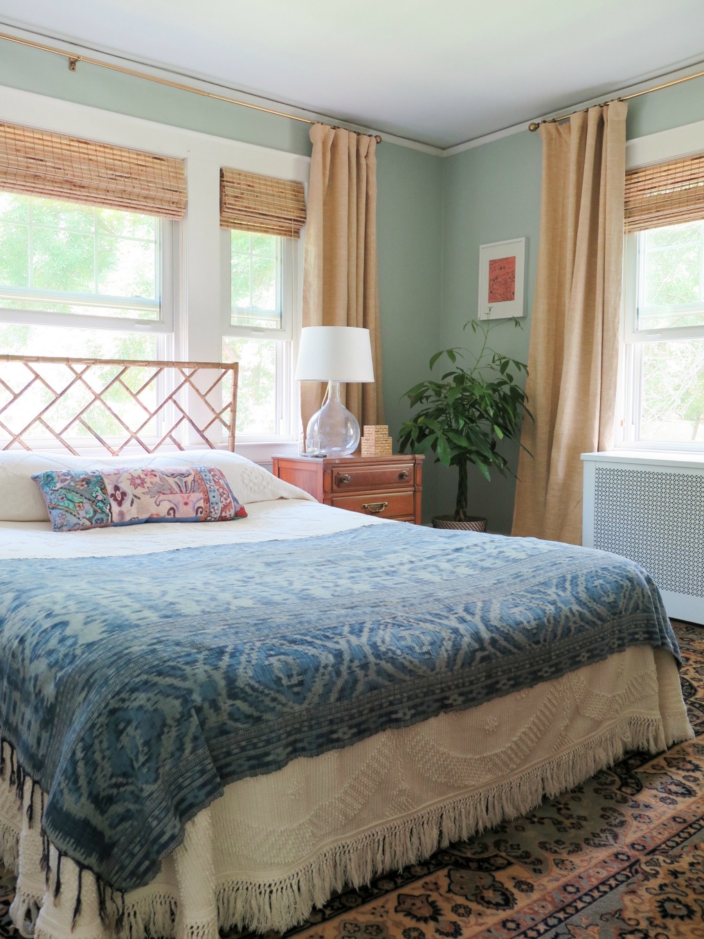 Vintage blue textile adds color to a white bedspread 