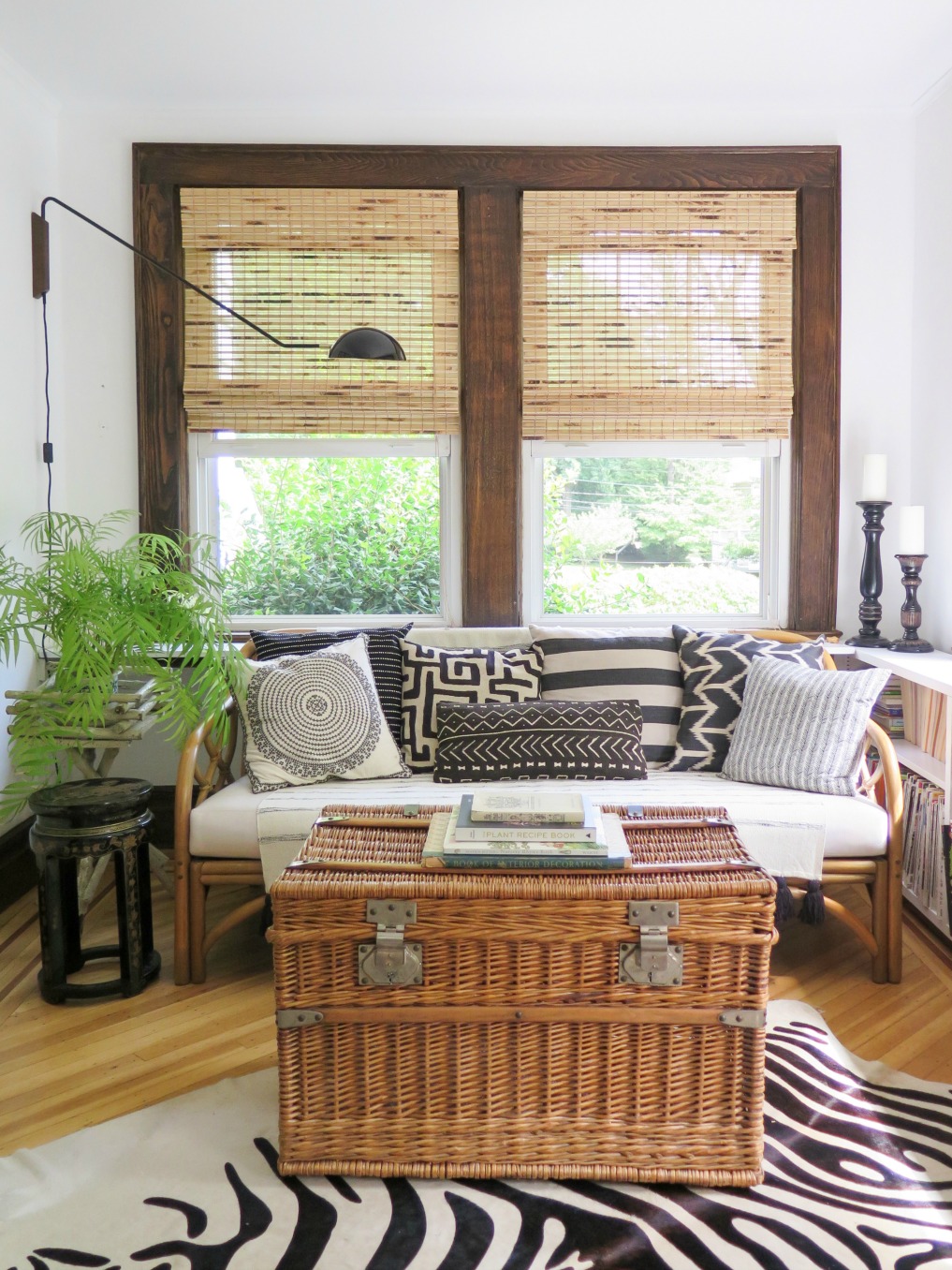 Boho home tour - love this neutral sunroom with texture from rattan, bamboo and lots of plants 