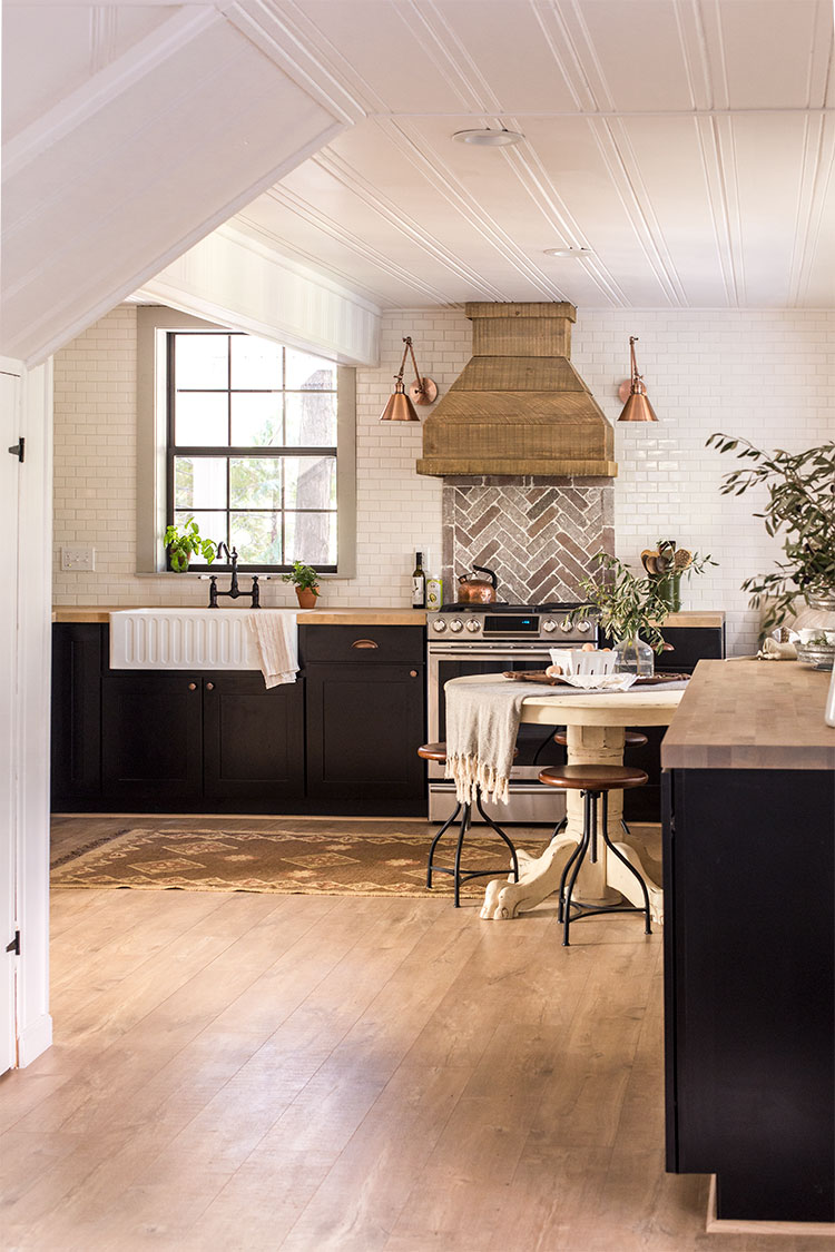 Cottage kitchen tour - love the subway tile mixed with brick backsplash and the gorgeous wood range hood