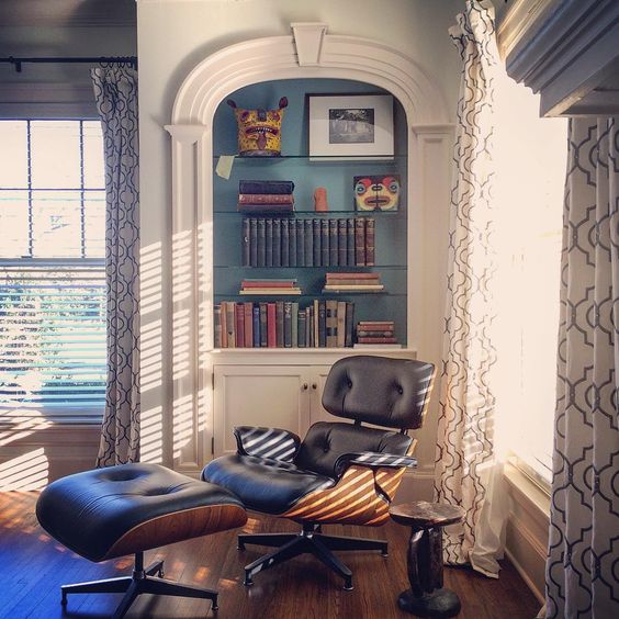 Built in bookcase with blue painted back - love the modern Eames chair kellyelko.com