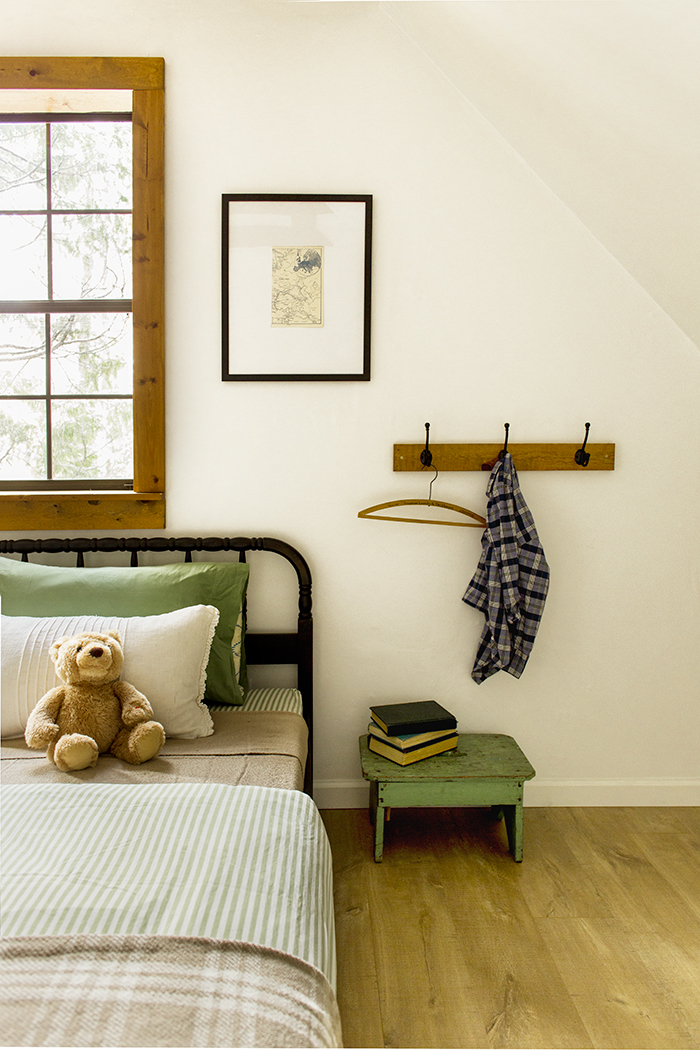 Cute kids bedroom with green step stool for books