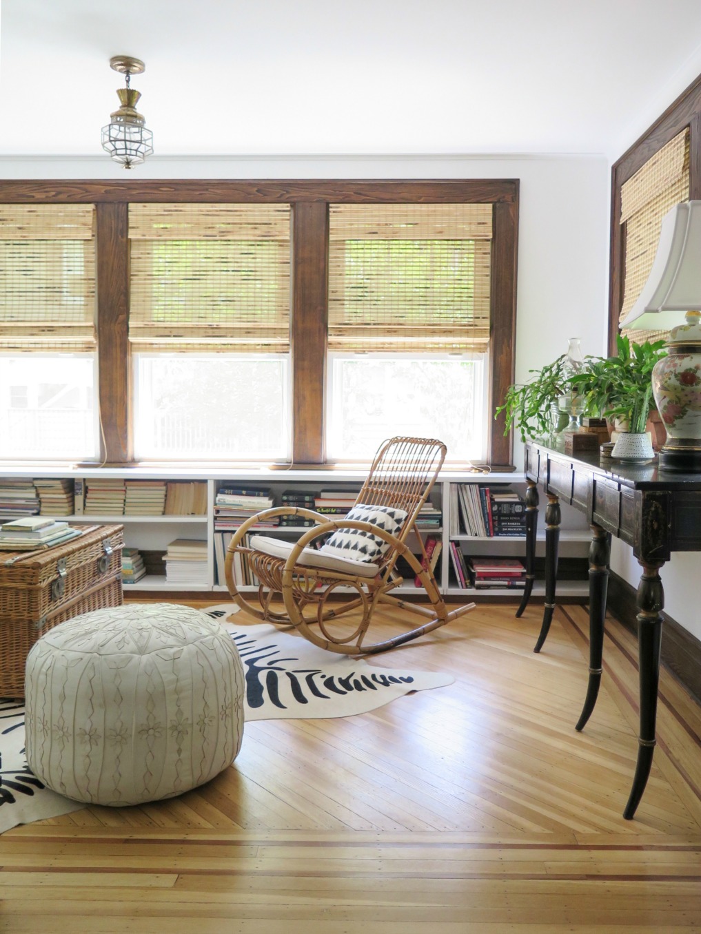 Boho home tour - love the rattan rocking chair and leather pouf in this 1920's home 