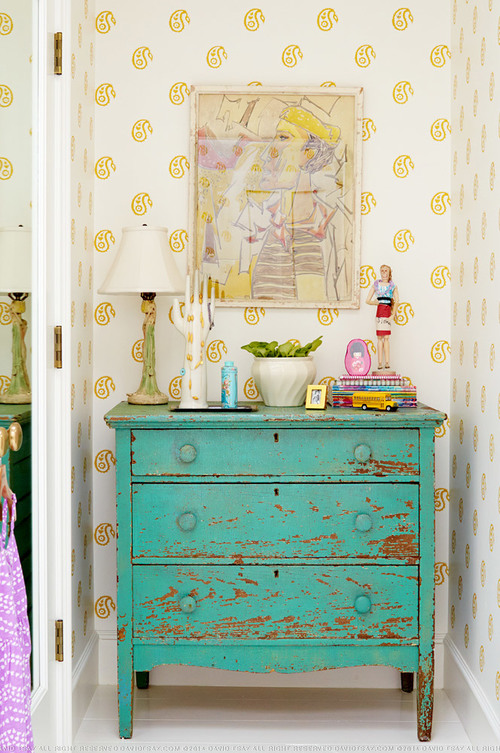 Chippy blue dresser with stenciled yellow wall