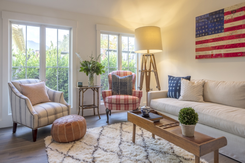 Casual family room with mismatched chairs and giant flag art