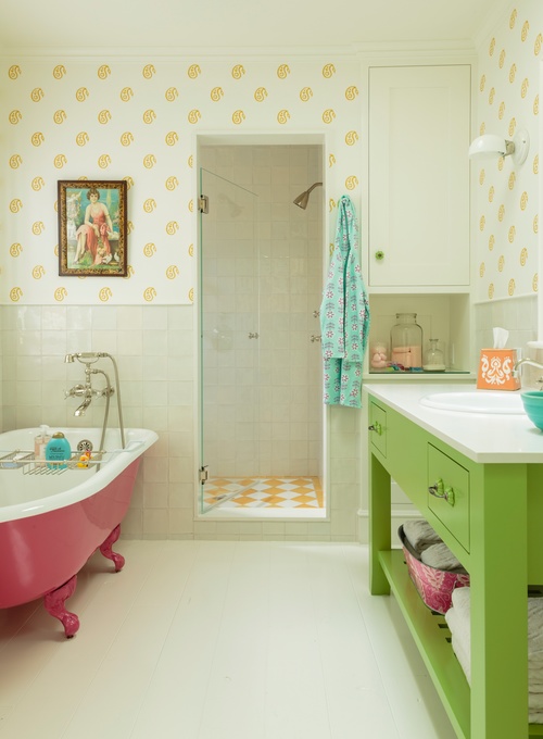 Green bathroom vanity and pink bathtub 