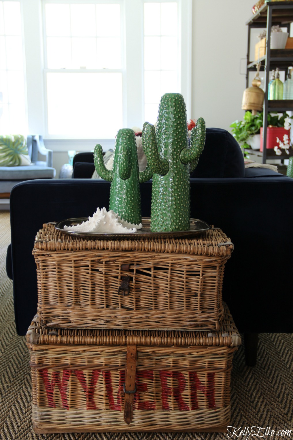 Stacked baskets make a unique side table and the cactus vases are so much fun kellyelko.com