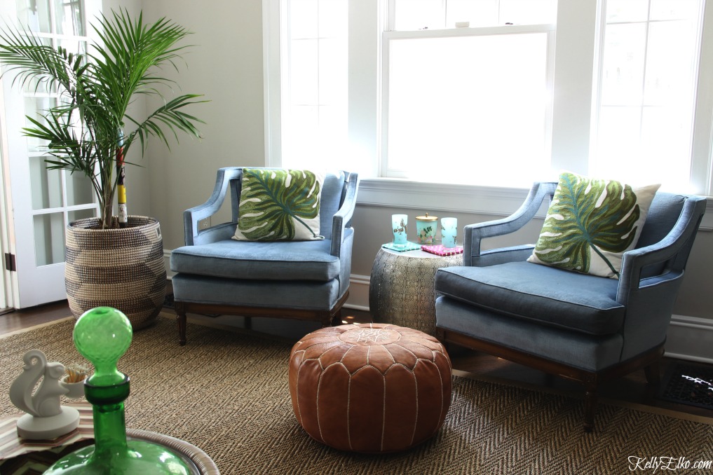 Pair of mid century club chairs in blue velvet with leather pouf and palm tree kellyelko.com