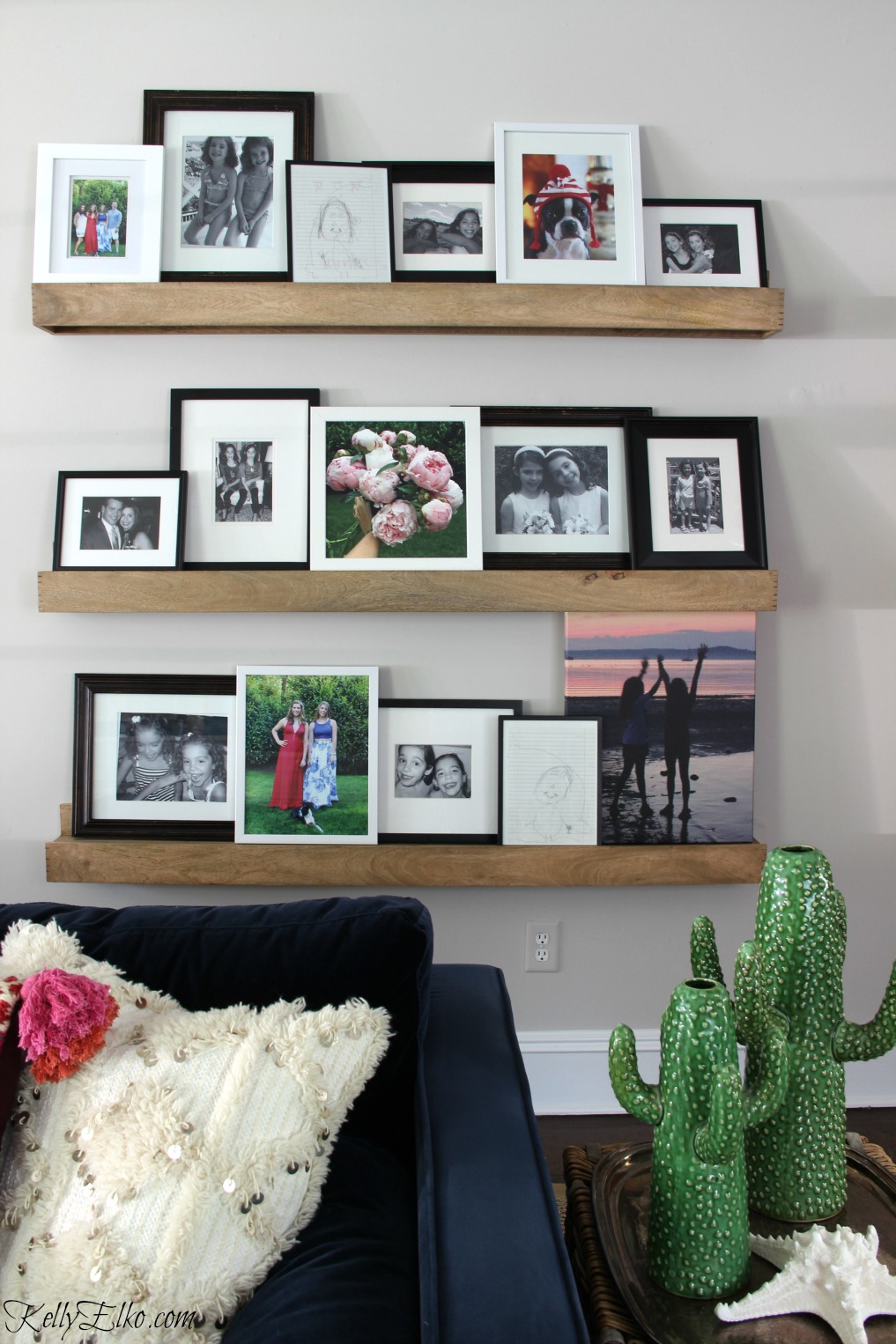 Love this black and white family photo gallery wall with a few pops of color kellyelko.com