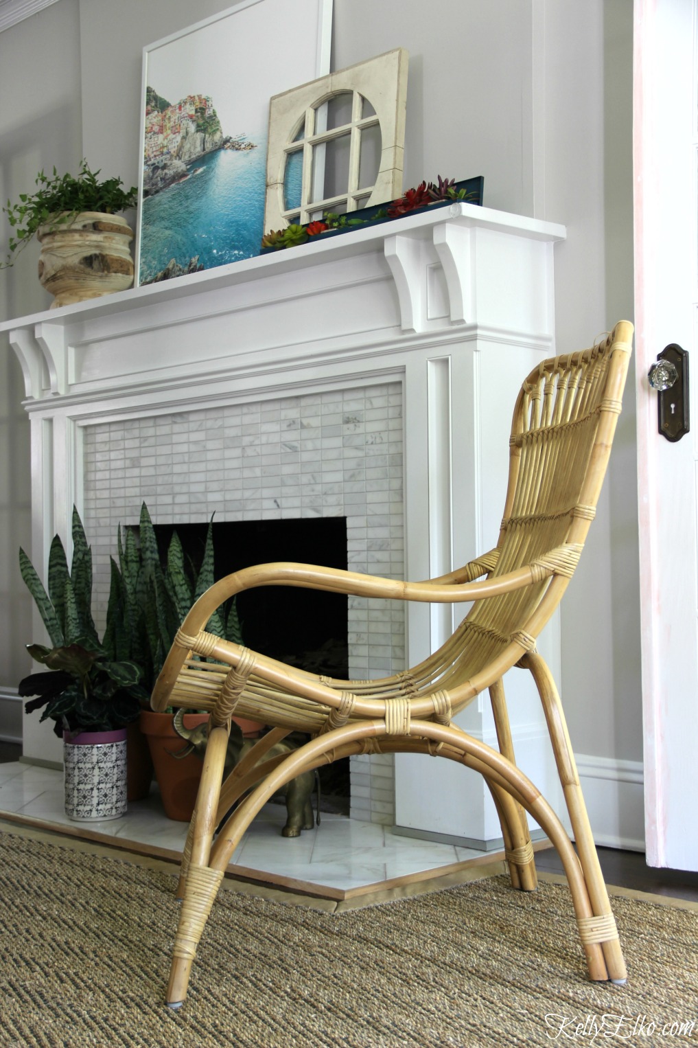 Love this outdoor rattan chair indoors - adds so much texture and a casual feel to the room kellyelko.com