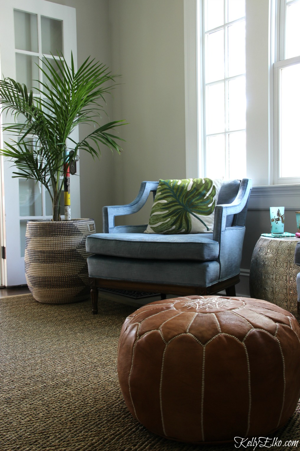 Love the palm tree in a basket paired with club chairs and a leather pouf kellyelko.com