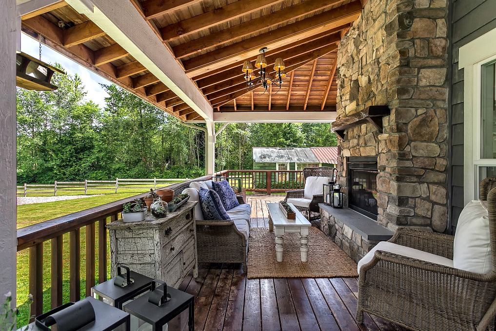 Farmhouse porch with stone fireplace kellyelko.com